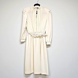 Vtg 80's cream color knit, longsleeve dress. Keyhole neck, pleat front, belted